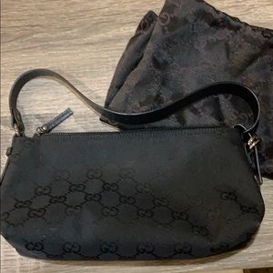 Black Gucci makeup bag